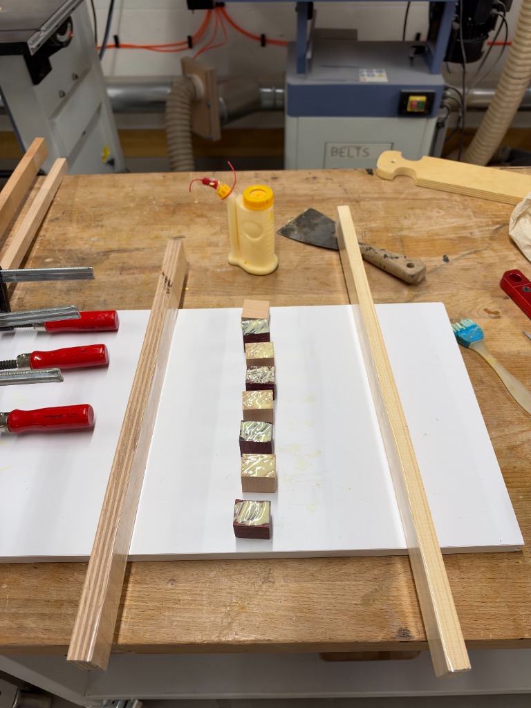 Detailed view of glued blocks between rails
