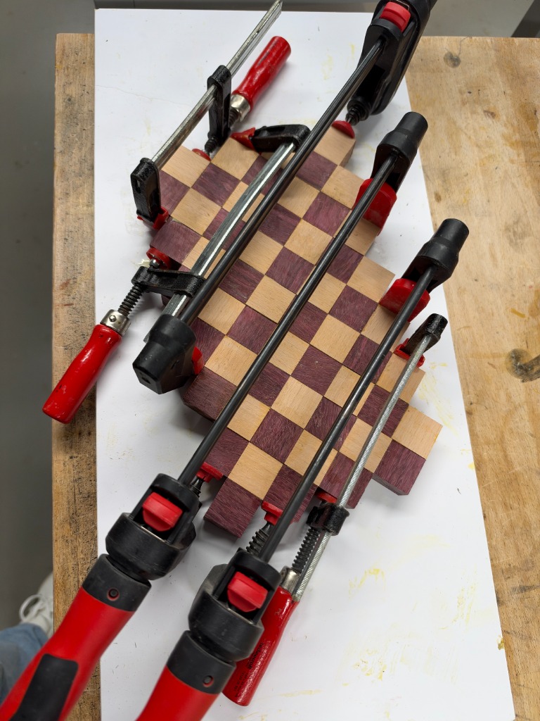 Full board clamped diagonally under heavy pressure