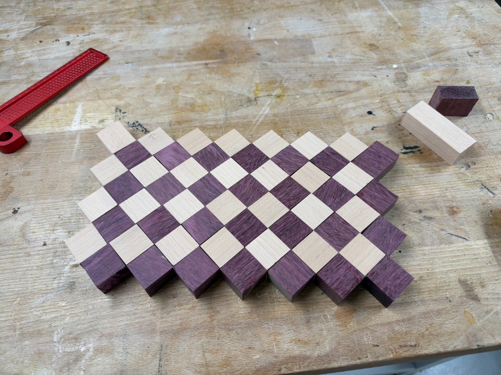 Glued board with red precision square and cutoffs