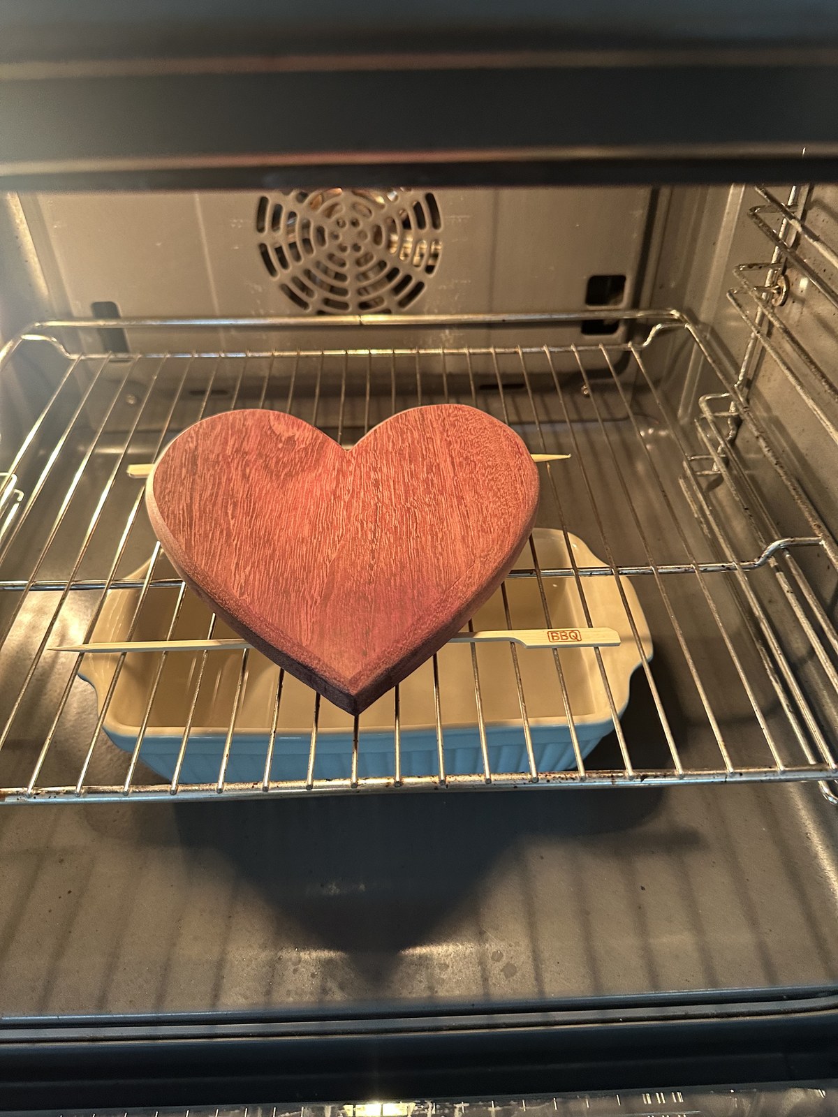 Purpleheart heart board during oven thermal color treatment