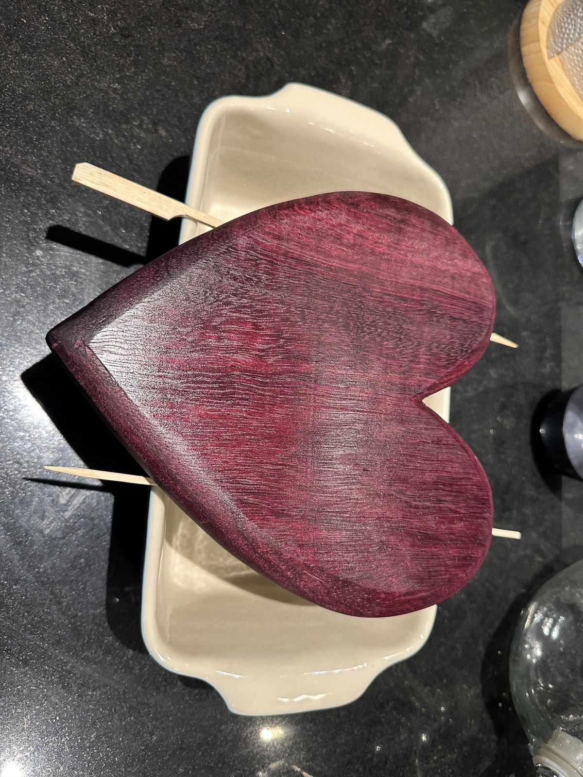 Applying Holz-Butter beeswax to the warm purpleheart board